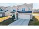 Beautiful two-story home featuring brick and siding, a covered porch, and attached two car garage at 6903 Aster Dr, Pendleton, IN 46064