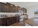 Elegant kitchen boasting dark cabinets, stainless steel appliances, and sleek countertops at 6903 Aster Dr, Pendleton, IN 46064