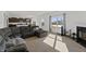 Inviting living room with a comfortable gray sectional sofa, fireplace, and seamless flow into the kitchen at 6903 Aster Dr, Pendleton, IN 46064