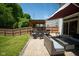 Backyard features an outdoor seating area and a partially retracted awning at 6913 Thousand Oaks Ln, Indianapolis, IN 46214
