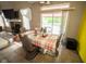 Open dining area with patio access, perfect for Gathering meals and entertaining at 6913 Thousand Oaks Ln, Indianapolis, IN 46214