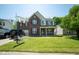 Traditional two-story brick home with well-manicured lawn at 6913 Thousand Oaks Ln, Indianapolis, IN 46214
