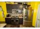 Bright kitchen with stainless steel appliances, granite countertops, and modern backsplash at 6913 Thousand Oaks Ln, Indianapolis, IN 46214