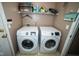 Bright laundry room with side-by-side new washer and dryer units at 6913 Thousand Oaks Ln, Indianapolis, IN 46214