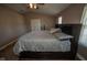 Spacious bedroom featuring a bed with storage, high ceiling with fan and hardwood floors at 6913 Thousand Oaks Ln, Indianapolis, IN 46214