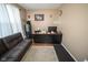 Cozy home office features a comfortable sofa, a desk, a filing cabinet, and hardwood flooring at 6913 Thousand Oaks Ln, Indianapolis, IN 46214