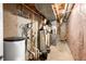 Unfinished basement space featuring utilities, ductwork, and ample storage potential at 7023 Hartington Pl, Indianapolis, IN 46259