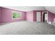 Large bedroom with gray carpet, a window, and light pink walls at 7023 Hartington Pl, Indianapolis, IN 46259