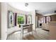 Bright dining area featuring large windows with view of backyard and a table at 7023 Hartington Pl, Indianapolis, IN 46259