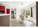 Sunlit dining area provides view of the laundry room and backyard at 7023 Hartington Pl, Indianapolis, IN 46259