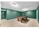 A spacious game room provides entertainment with a classic billiards table and room for recreation at 7023 Hartington Pl, Indianapolis, IN 46259