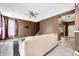 Bright living room featuring tile floors, ceiling fan, and access to the staircase and other rooms at 7023 Hartington Pl, Indianapolis, IN 46259