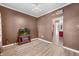 Living space featuring wood floors, neutral walls, and a glimpse into an adjacent room at 7023 Hartington Pl, Indianapolis, IN 46259
