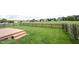 Backyard featuring a large grassy area enclosed by a wood fence and a small wood deck at 7131 Blue Ridge Dr, Noblesville, IN 46062