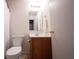 Bathroom with vanity, mirror, and toilet with white towel hanging at 7131 Blue Ridge Dr, Noblesville, IN 46062