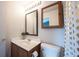 Bathroom featuring a vanity, framed mirror, medicine cabinet, toilet, and shower with curtain at 7131 Blue Ridge Dr, Noblesville, IN 46062