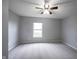 Bright bedroom with neutral gray carpet and a large window at 7131 Blue Ridge Dr, Noblesville, IN 46062