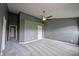 Expansive bedroom boasts neutral walls, soft carpet, a ceiling fan, and convenient access to other rooms at 7131 Blue Ridge Dr, Noblesville, IN 46062
