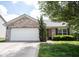 Charming single-story home with a two-car garage, and a well-maintained front yard at 7131 Blue Ridge Dr, Noblesville, IN 46062
