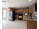 Traditional kitchen with stainless steel appliances, wooden cabinets and lots of counter space at 7131 Blue Ridge Dr, Noblesville, IN 46062