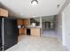 Efficient kitchen with black appliances, ample cabinet space and view of the living room at 7131 Blue Ridge Dr, Noblesville, IN 46062