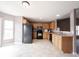 Charming kitchen featuring wood cabinets, black appliances, and ample countertop space at 7131 Blue Ridge Dr, Noblesville, IN 46062