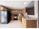 Well-lit kitchen showcasing a breakfast bar, stainless steel appliances, and plentiful counter space at 7131 Blue Ridge Dr, Noblesville, IN 46062