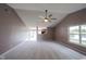 Comfortable living room with carpeted floor, vaulted ceiling and natural light at 7131 Blue Ridge Dr, Noblesville, IN 46062