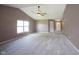 Bright living room with vaulted ceiling, neutral paint, carpeting and a view of the front entryway at 7131 Blue Ridge Dr, Noblesville, IN 46062