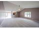 Spacious living room with vaulted ceilings, ceiling fan and an open floor plan at 7131 Blue Ridge Dr, Noblesville, IN 46062