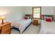 Bedroom showcasing two beds, a window, and natural light at 7189 Creekwood Estates, Brownsburg, IN 46112