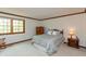 Cozy bedroom with natural light, neutral colors, and wood trim offering a relaxing atmosphere at 7189 Creekwood Estates, Brownsburg, IN 46112