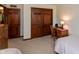 Bright bedroom with a desk, chair, and built-in wardrobe, creating a functional space at 7189 Creekwood Estates, Brownsburg, IN 46112