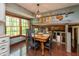 Dining area with hardwood floors and a hanging chandelier at 7189 Creekwood Estates, Brownsburg, IN 46112