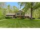 Charming two-story home featuring a lush green lawn and mature trees, providing a serene setting at 7189 Creekwood Estates, Brownsburg, IN 46112