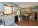 Bright kitchen featuring white cabinets, stainless steel appliances, and an eat-in area with backyard views at 7189 Creekwood Estates, Brownsburg, IN 46112