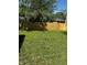 The backyard is fenced and green at 7334 Westchester Dr, Indianapolis, IN 46226