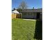 The backyard has a lovely lawn at 7334 Westchester Dr, Indianapolis, IN 46226