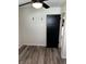 This bedroom has neutral paint, new floors, and a fan, offering comfort and style at 7334 Westchester Dr, Indianapolis, IN 46226