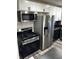 Well-equipped kitchen with stainless steel appliances, white cabinets, and a black countertop, ready for culinary adventures at 7334 Westchester Dr, Indianapolis, IN 46226