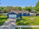 Aerial view of a single-story home with a well-manicured lawn, and an attached garage at 7645 Madden Dr, Fishers, IN 46038