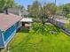 The fenced backyard features a covered patio, fire pit, and mature trees, perfect for relaxing at 7645 Madden Dr, Fishers, IN 46038
