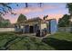 Backyard with a covered patio and a well-maintained lawn, perfect for outdoor entertaining at 7645 Madden Dr, Fishers, IN 46038