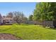 Expansive backyard featuring a well-maintained lawn and a fenced perimeter for privacy at 7645 Madden Dr, Fishers, IN 46038
