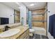 Bathroom showcasing tile floors, granite countertops, and a combined tub and shower at 7645 Madden Dr, Fishers, IN 46038