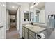 Bathroom boasts granite counters, decorative mirror, and tiled floors at 7645 Madden Dr, Fishers, IN 46038