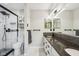 Modern bathroom featuring a vanity, walk-in shower, and an abundance of natural light at 7645 Madden Dr, Fishers, IN 46038