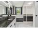 Modern bathroom featuring a vanity, walk-in closet, marble floors and plenty of storage space at 7645 Madden Dr, Fishers, IN 46038