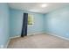 Bedroom with neutral carpet, light blue walls, and a window letting in natural light at 7645 Madden Dr, Fishers, IN 46038