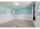 Carpeted bedroom featuring light blue walls, white trim and a bright window at 7645 Madden Dr, Fishers, IN 46038